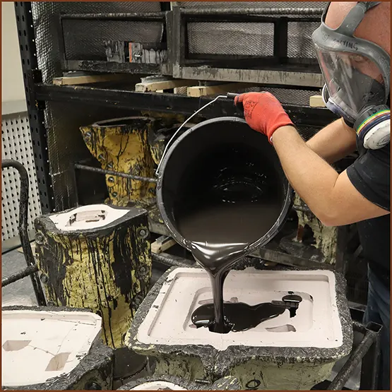 Picture of Dolomite Stone mix being poured into a production mould