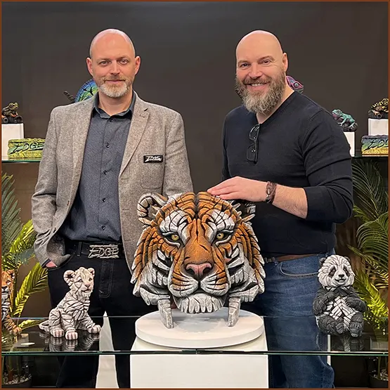 Matt and Dan with a Siberian Tiger Bust at an Edge Sculpture exhibition display stand at a trade show