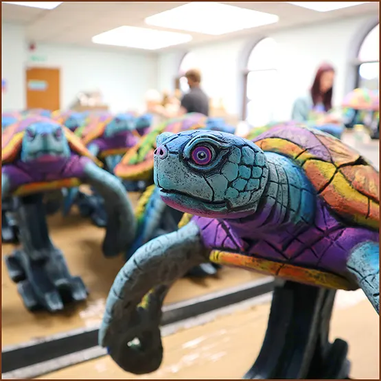 Picture of a colourful limited edition Sea Turtle in the painting studio