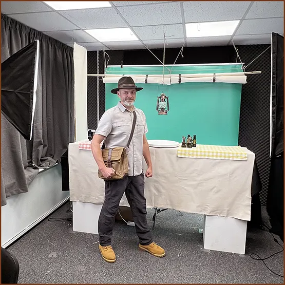 Dan Buckley wearing an outfit as we prepare the set ready to begin filming a YouTube presentation in front of a green screen