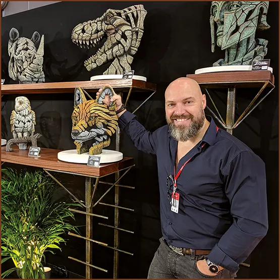 Matt Buckley at an Edge Sculpture exhibition display stand at a trade show