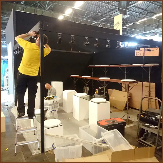 Paul Williamson building an Edge Sculpture exhibition display stand at a trade show