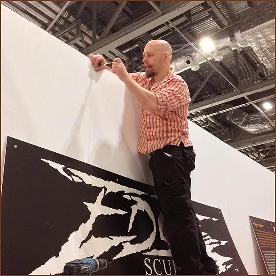 Matt Buckley building an Edge Sculpture exhibition display stand at a trade show