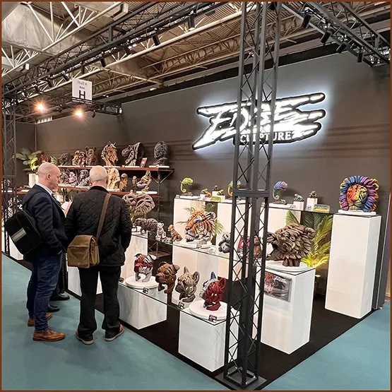 Customers visiting an Edge Sculpture exhibition display stand at a trade show